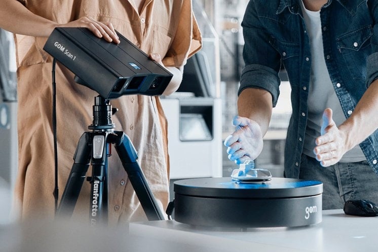 Two engineers using the GOM Scan 1 to scan a complex part