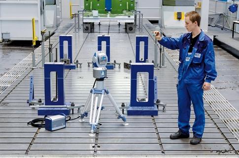 Engineer using a laser tracker to measure objects in six degrees of freedom