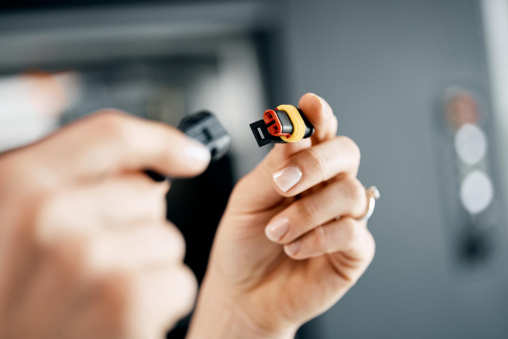 Engineer clips together precisely fitting wire parts